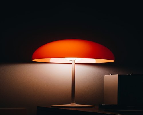 Desk lamp illuminating a workspace softly
